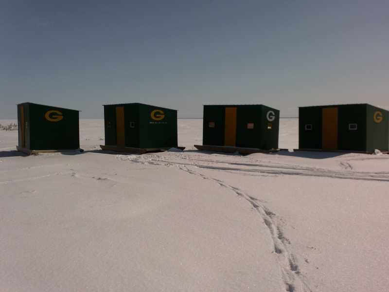 four ice shacks with the green bay packers logo on them